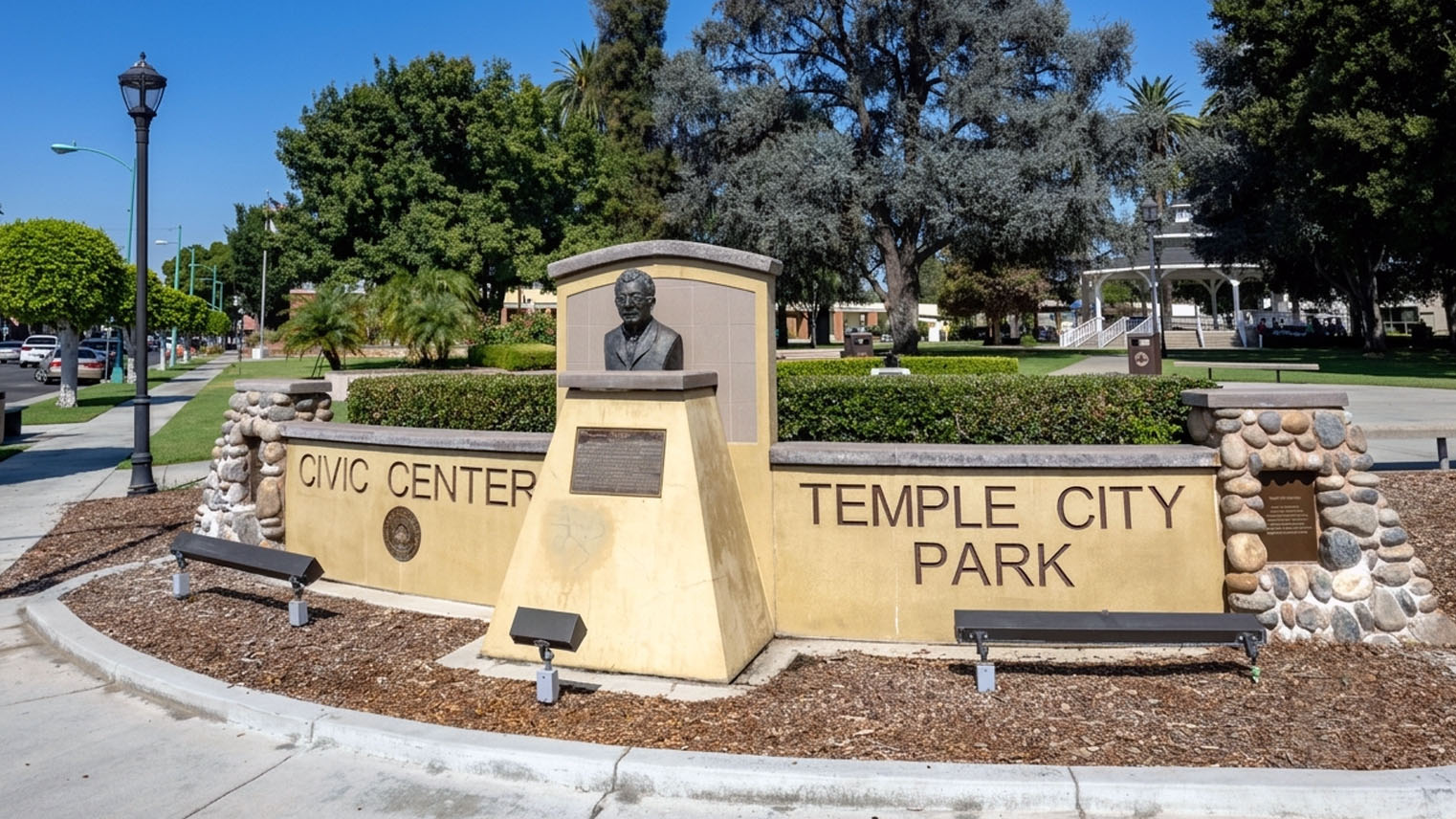 Bronze bust of Walter P. Temple at the Temple City Park civic monument, lawns and the park gazebo behind.